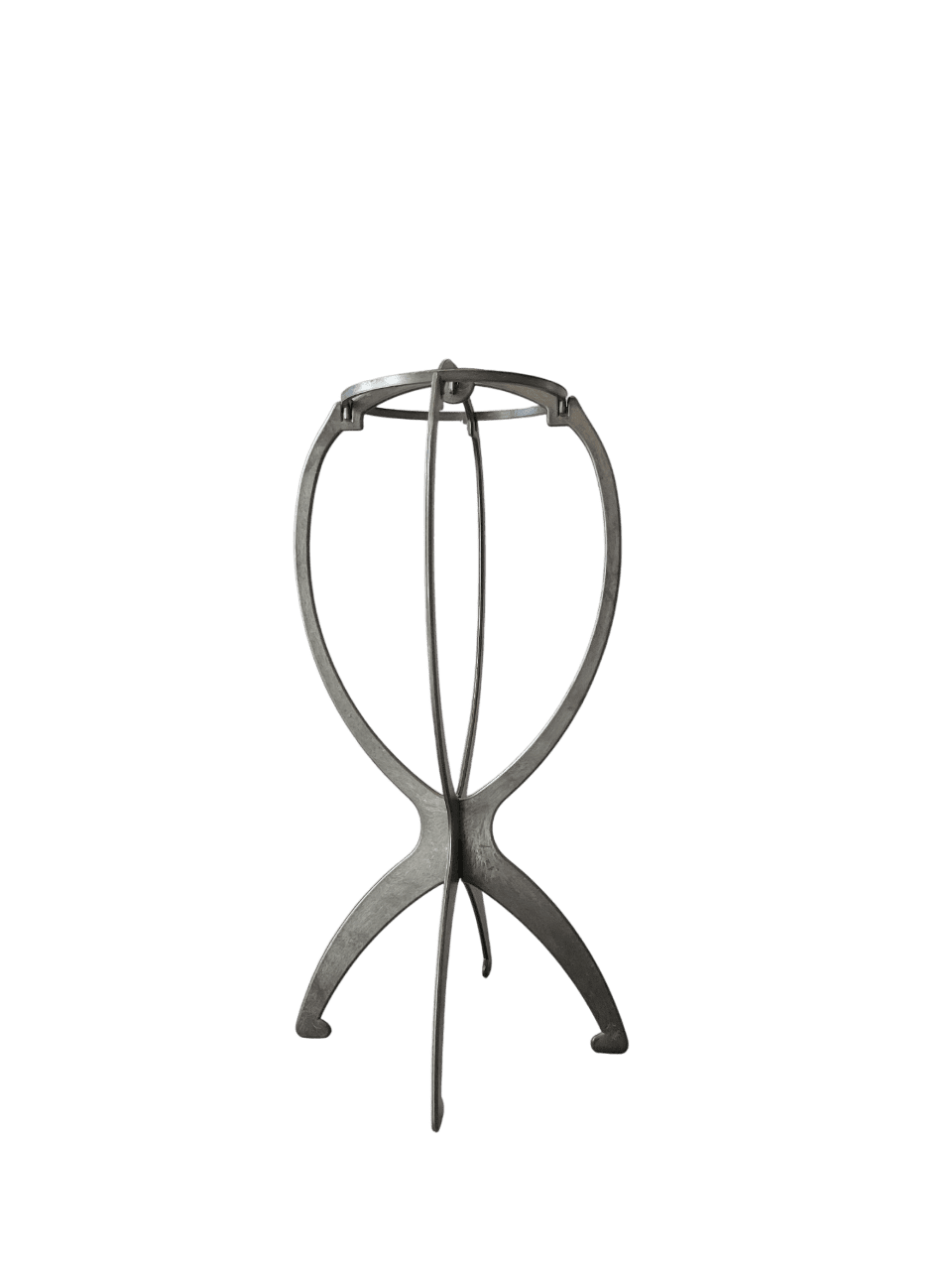 A metal tripod stand with a green background