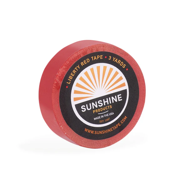 A red round container with sunshine logo on it.