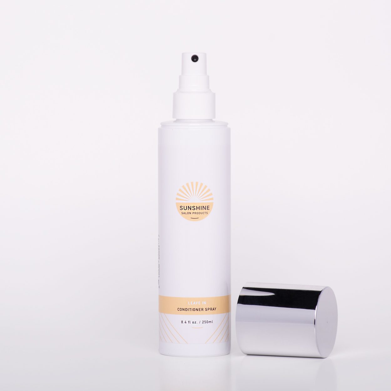 A bottle of lotion next to a container.