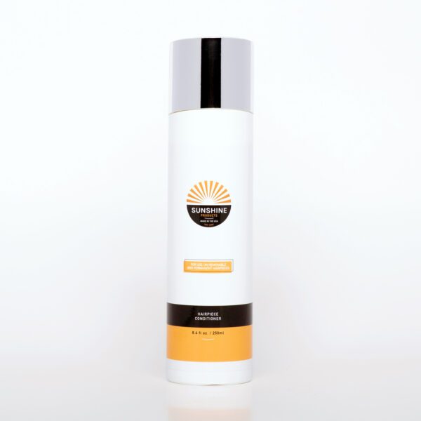 A bottle of sunscreen sitting on top of a table.
