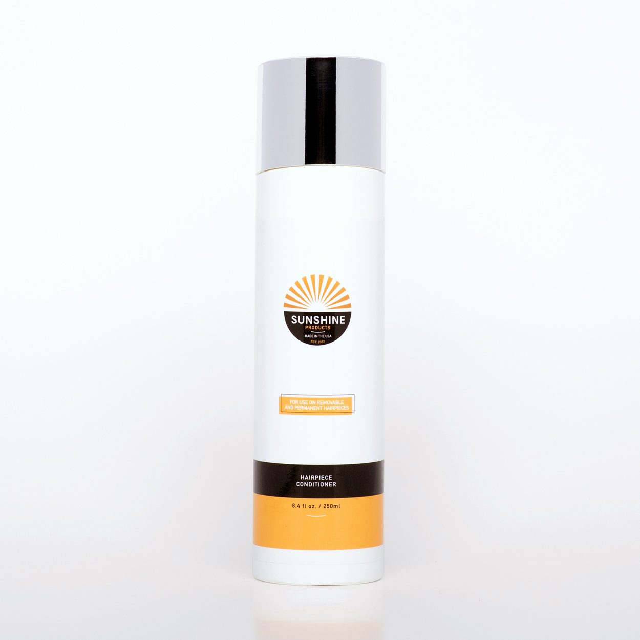 A bottle of sunscreen sitting on top of a table.