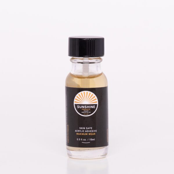 A bottle of oil sitting on top of a table.