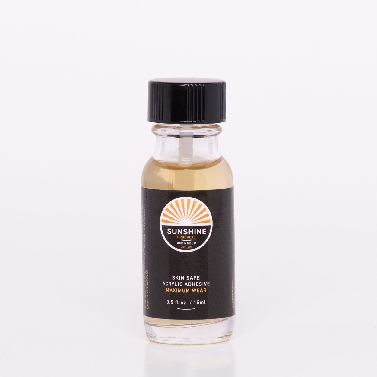 A bottle of oil sitting on top of a table.