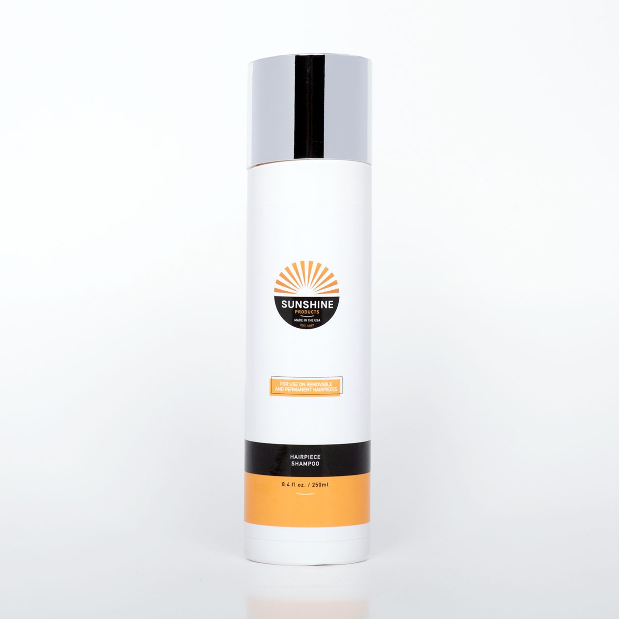 A bottle of sunscreen sitting on top of a table.
